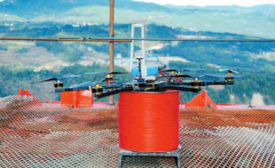 Hexacopter carries pilot line in bridge construction – first time ever!
