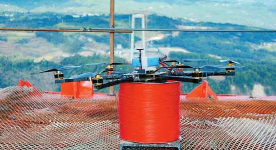 Hexacopter carries pilot line in bridge construction – first time ever!