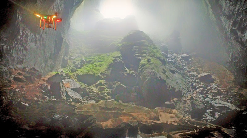 The DJI Inspire 1 flies behind the DJI Phantom 3 to capture the ascent up to the top of the stalagmite. 