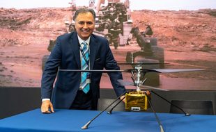 AV CEO Wahid Nawabi poses with a model of the Mars Helicopter. Photo: AeroVironment